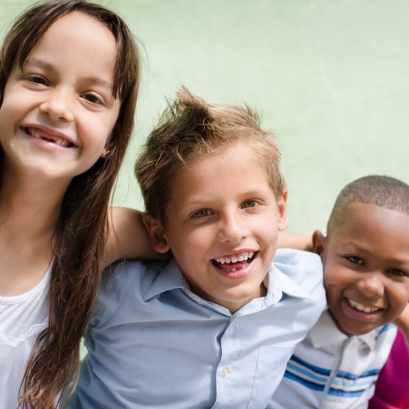 happy children hugging, smiling and having fun